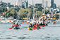 A group of people enjoying kayaking and paddleboarding on the beautiful waters of Vancouver.